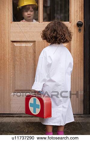 Girl playing doctor making house call View Large Photo Image Stock Image - Girl playing doctor making house call. Fotosearch
