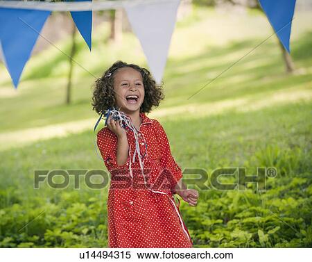 Girl playing with ribbons outdoors View Large Photo Image Stock Photography - Girl playing with ribbons outdoors. Fotosearch