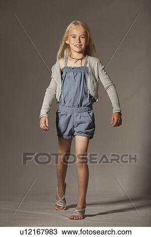 Girl smiling in studio View Large Photo Image Stock Image - Girl smiling in studio. Fotosearch