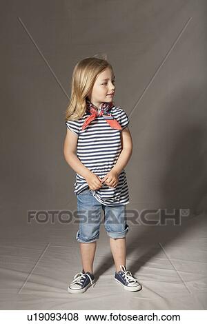 Stock Photo - Girl smiling in studio. Fotosearch
