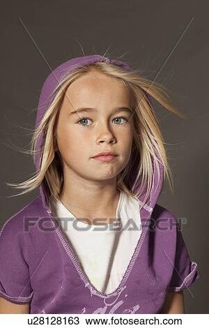 Girl standing in studio View Large Photo Image Stock Image - Girl standing in studio. Fotosearch