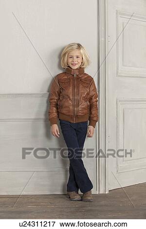 Girl wearing jacket indoors View Large Photo Image Stock Photo - Girl wearing jacket indoors. Fotosearch