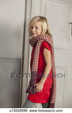 Girl wearing long scarf indoors View Large Photo Image Stock Photograph - Girl wearing long scarf indoors. Fotosearch