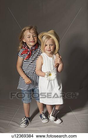 Girls smiling in studio View Large Photo Image Picture - Girls smiling in studio. Fotosearch
