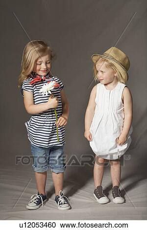 Girls smiling in studio View Large Photo Image Stock Image - Girls smiling in studio. Fotosearch