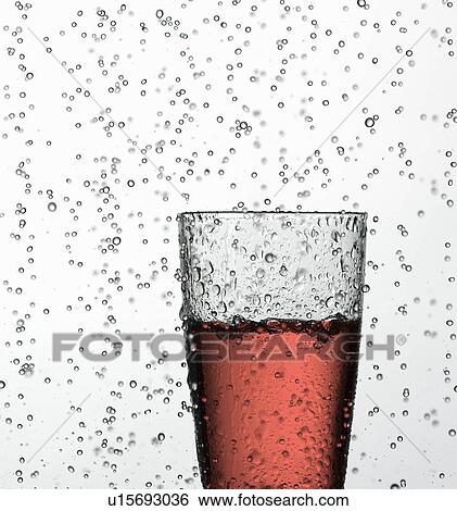 Glass of juice in water drops View Large Photo Image Stock Photograph - Glass of juice in water drops. Fotosearch