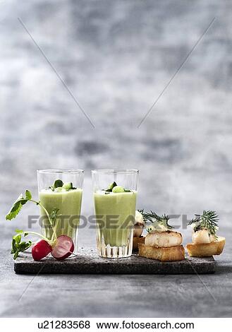 Glass of pea soup and scallop canapes View Large Photo Image Stock Photo - Glass of pea soup and scallop canapes. Fotosearch