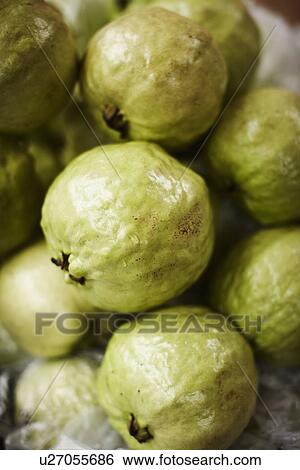 Stock Photograph - Green fruit for sale at market. Fotosearch