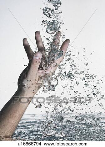 Hand thrust into water View Large Photo Image Picture - Hand thrust into water. Fotosearch