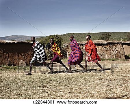 Stock Image - Maasai men walking together. Fotosearch