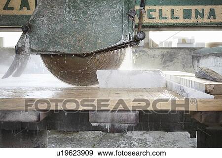 Machinery cutting stone on board View Large Photo Image Stock Photo - Machinery cutting stone on board. Fotosearch