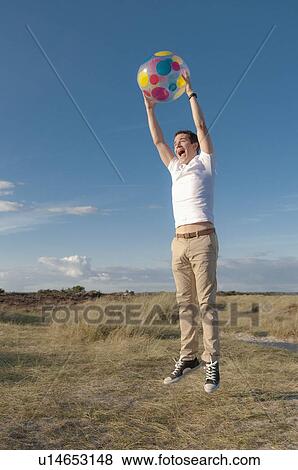 Man jumping for joy outdoors View Large Photo Image Stock Photo - Man jumping for joy outdoors. Fotosearch