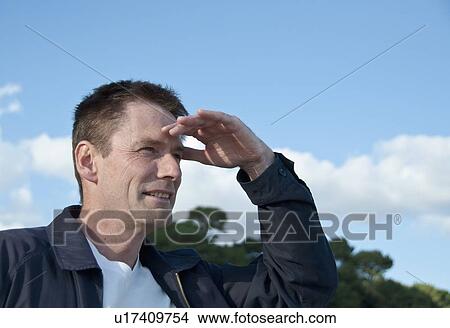 Man overlooking landscape outdoors View Large Photo Image Picture - Man overlooking landscape outdoors. Fotosearch