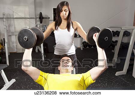 Man working with trainer at gym View Large Photo Image Stock Photo - Man working with trainer at gym. Fotosearch