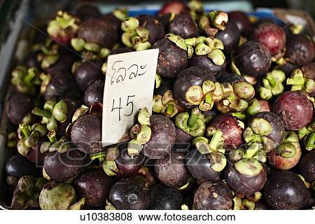 Stock Photo - Mangosteen for sale at market. Fotosearch