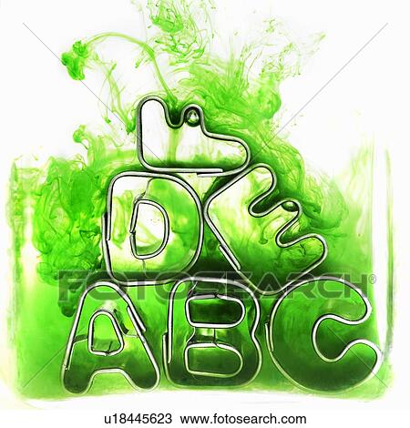 Stock Image - Metal letter shapes stacked together. Fotosearch