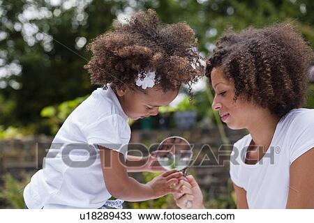 Mother and daughter playing outdoors View Large Photo Image Stock Image - Mother and daughter playing outdoors. Fotosearch