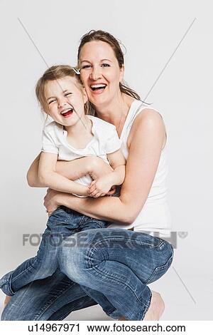 Mother and daughter smiling together View Large Photo Image Stock Image - Mother and daughter smiling together. Fotosearch