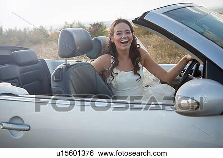 Newlywed bride sitting in convertible View Large Photo Image Stock Photograph - Newlywed bride sitting in convertible. Fotosearch
