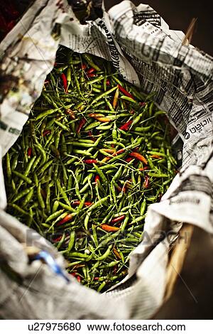 Stock Image - Newspaper wrapping bucket of chili. Fotosearch