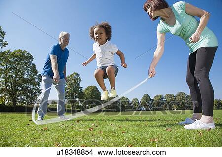 Older couple playing with granddaughter View Large Photo Image Picture - Older couple playing with granddaughter. Fotosearch