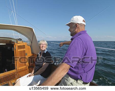 Older couple sailing together on ocean View Large Photo Image Stock Photo - Older couple sailing together on ocean. Fotosearch