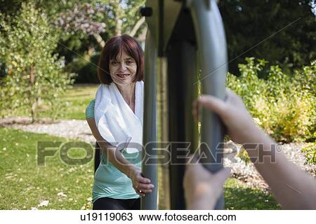 Older couple using exercise equipment View Large Photo Image Stock Image - Older couple using exercise equipment. Fotosearch