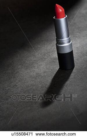 Open tube of red lipstick on table View Large Photo Image Stock Image - Open tube of red lipstick on table. Fotosearch