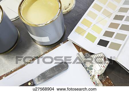 Picture - Paint can, swatches and pallet knife. Fotosearch