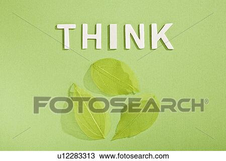 Stock Image - Paper cut out of Think with leaves. Fotosearch