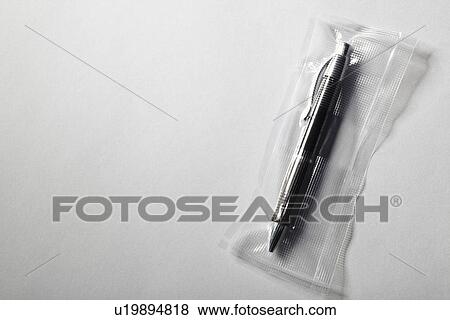 Pen shrink wrapped in plastic View Large Photo Image Stock Photo - Pen shrink wrapped in plastic. Fotosearch