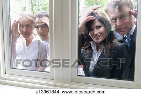 People peering in windows of house View Large Photo Image Picture - People peering in windows of house. Fotosearch