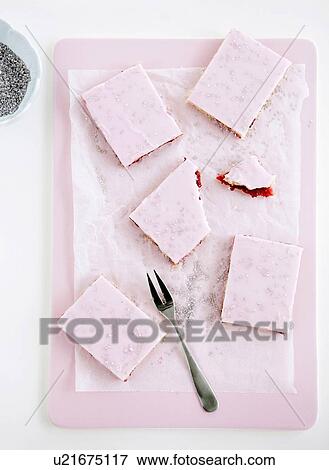 Stock Photo - Pink desserts on tray. Fotosearch