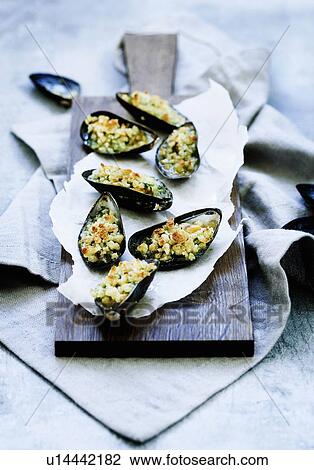 Plate of baked mussels View Large Photo Image Stock Image - Plate of baked mussels. Fotosearch
