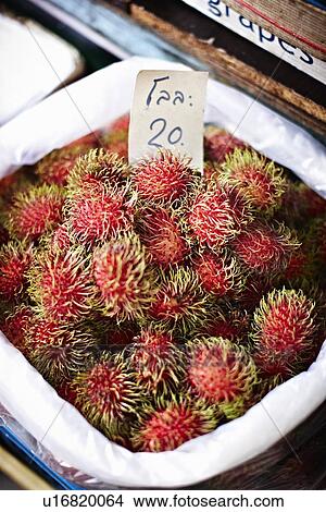 Picture - Rambutan for sale at market. Fotosearch