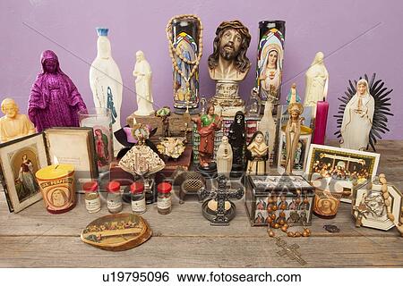 Stock Photograph - Religious icons and crosses on table. Fotosearch