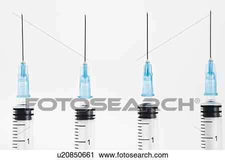 Row of blue syringes View Large Photo Image Stock Image - Row of blue syringes. Fotosearch