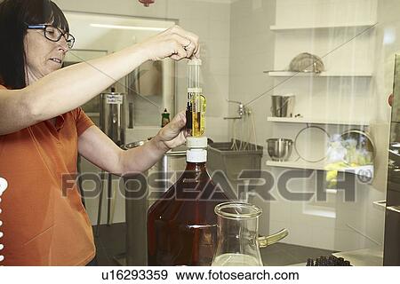 Scientist working in lab View Large Photo Image Stock Photo - Scientist working in lab. Fotosearch