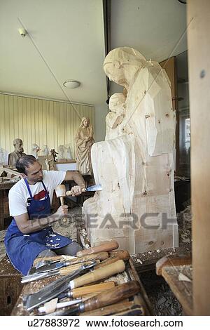 Sculptor chiseling figure from wood View Large Photo Image Stock Image - Sculptor chiseling figure from wood. Fotosearch