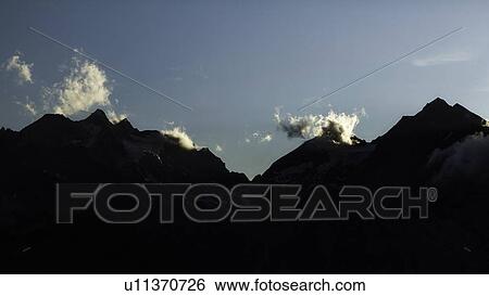Silhouette of jagged mountain range View Large Photo Image Stock Photograph - Silhouette of jagged mountain range. Fotosearch