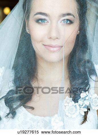 Smiling bride wearing veil View Large Photo Image Stock Photography - Smiling bride wearing veil. Fotosearch