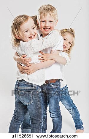 Smiling children hugging View Large Photo Image Stock Image - Smiling children hugging . Fotosearch