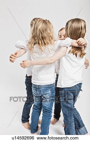 Stock Photograph - Smiling children hugging . Fotosearch
