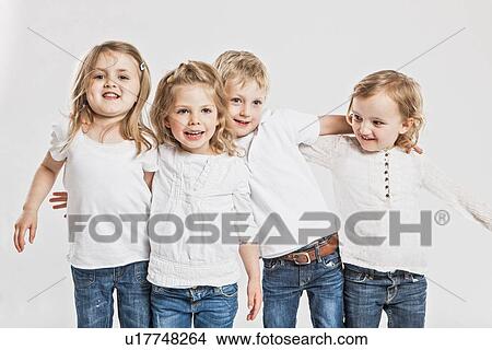 Smiling children posing together View Large Photo Image Picture - Smiling children posing together. Fotosearch