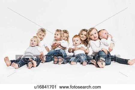 Smiling children posing together View Large Photo Image Stock Image - Smiling children posing together. Fotosearch