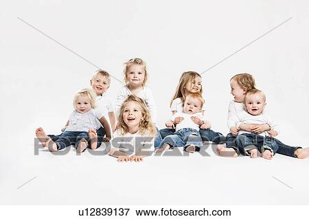 Smiling children posing together View Large Photo Image Stock Photo - Smiling children posing together. Fotosearch