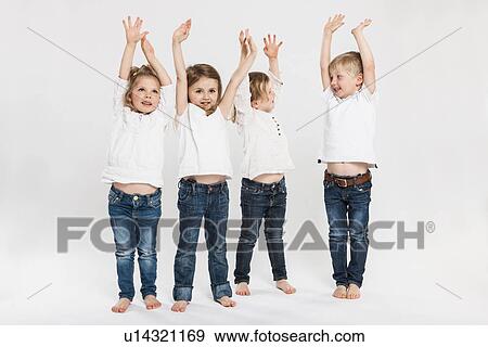 Stock Photo - Smiling children posing together. Fotosearch