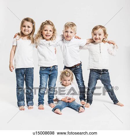 Smiling children posing together View Large Photo Image Stock Photo - Smiling children posing together. Fotosearch