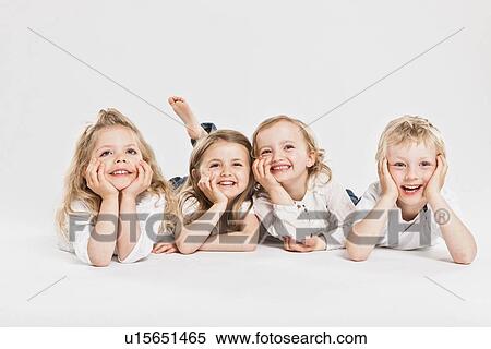 Smiling children posing together View Large Photo Image Stock Photography - Smiling children posing together. Fotosearch
