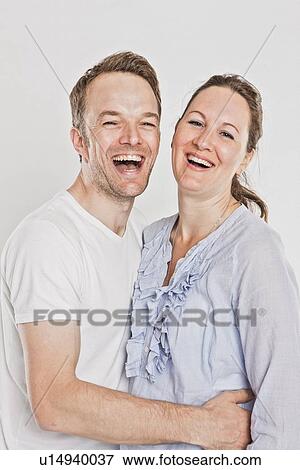 Smiling couple laughing View Large Photo Image Stock Photo - Smiling couple laughing . Fotosearch